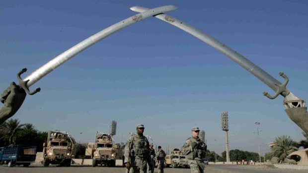 The giant pair of crossed swords erected by Saddam Hussein in the heart of Baghdad. The vulgar monument is being refurbished ahead of next month's Arab League summit.