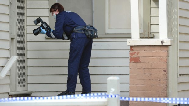 A homocide police officer attends the house, where an investigation is underway into the death.