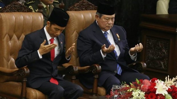 Lives in their hands: Incoming Indonesian President Joko Widodo and outgoing Susilo Bambang Yudhoyono.