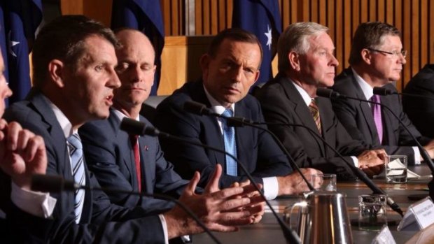 Looking for consensus: Prime Minister Tony Abbott with state premiers and chief ministers at COAG on Friday.