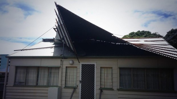 A house in Hervey Bay lost half its roof when a water spout tore down the street on Tuesday morning. Photo: Nine News.