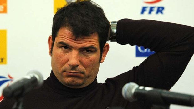 Marc Lievremont reacts during a press conference the day after his players lost their match against Italy.