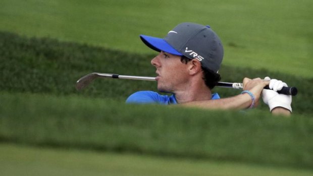 Out in front: British Open winner Rory McIlroy leads the US PGA Championship by one shot going into the final round.