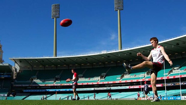 Boot to ball &#8230; Gary Rohan goes through his paces during Swans training at the SCG.
