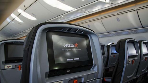 Jetstar's Dreamliner features seatback touchscreens, though economy passengers will need to swipe their credit cards to access entertainment.