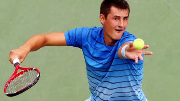 Bernard Tomic is through to the second round at the US Open.