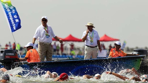 Competitors in the women's 10km open water swimming race at Jinshan Beach in Shanghai.