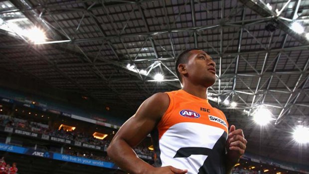 New start ... GWS Giants marquee signing Israel Folau runs out onto ANZ Stadium last night.