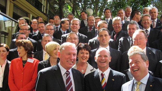 Opposition interim leader Jeff Seeney, leader-in-waiting Campbell Newman and deputy leader Tim Nicholls gather for a photo with LNP MPs and candidates.