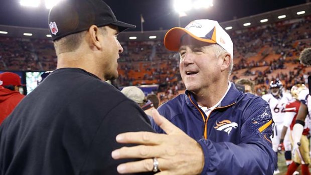 John Fox (right) with San Francisco 49ers head coach Jim Harbaugh back in August.