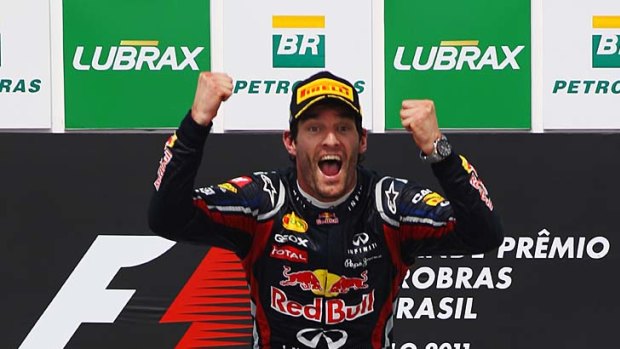Flying finish: Red Bull's Mark Webber celebrates.