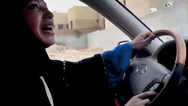 A Saudi Arabian woman drives a car as part of a campaign to defy Saudi Arabia's ban on women driving, in Riyadh, Saudi Arabia.