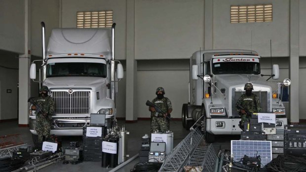 The Mexican Navy stands guard over seized telecommunications equipment, allegedly built by the Zetas drug cartel.