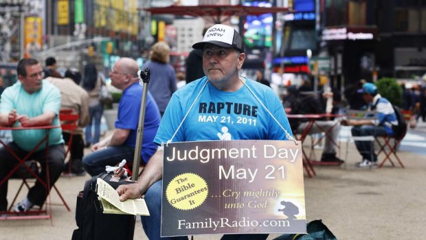 A volunteer from the US religious group Family Radio hands out pamphlets at Times Square in New York  with warnings of an impending Judgment Day.