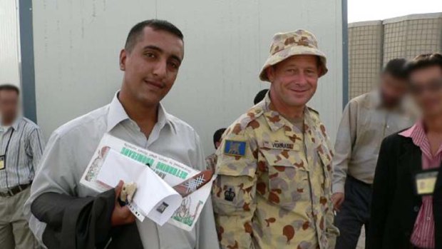 Going home ... interpreter Ali Risn with an Australian soldier; and Risn on the ground in Iraq.