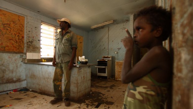 "Living here is not good": Wadeye resident Alfred Thardim and an unidentified child at home. People sleep at least eight to a room.
