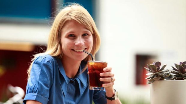 Fleur Studd with a coffee on ice at the Market Lane cafe in Prahran Market.