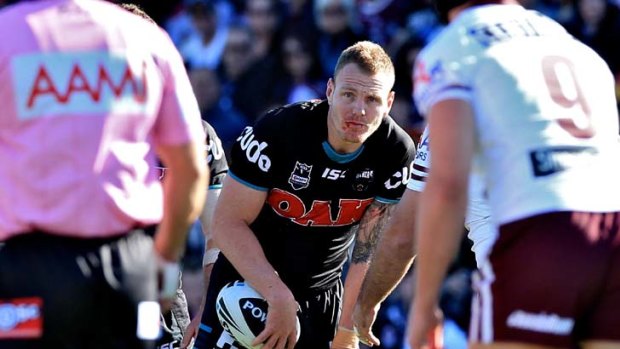 Low blow &#8230; Panthers lock Luke Lewis put the drama of losing the captaincy behind him to focus on helping his team upset the premiers, Manly, at Centrebet Stadium yesterday.