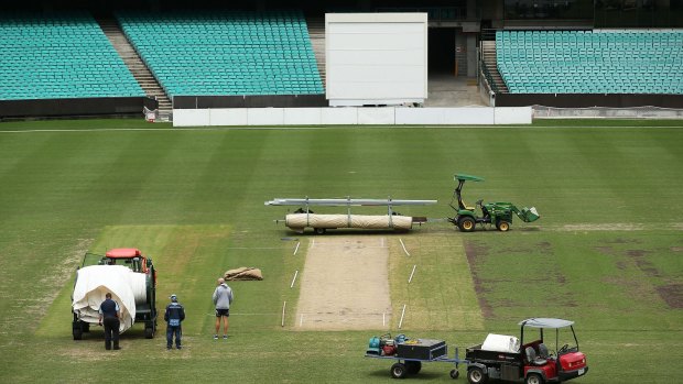 No play: Ground staff and officals announce abandonment of the NSW v Victoria match due to wet conditions during day three at the Sydney Cricket Ground.
