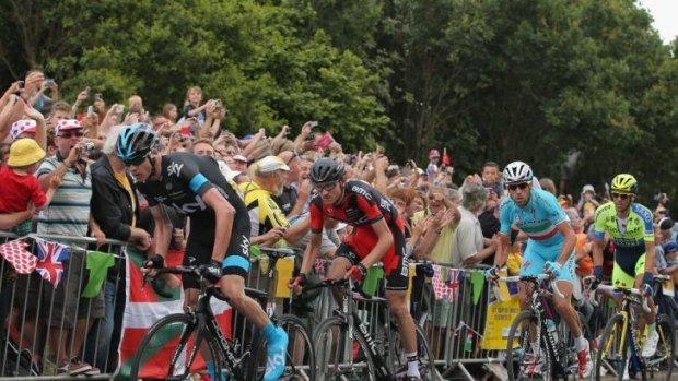 Defending champion Chris Froome, of Team Sky, attacks on the final climb into Sheffield.