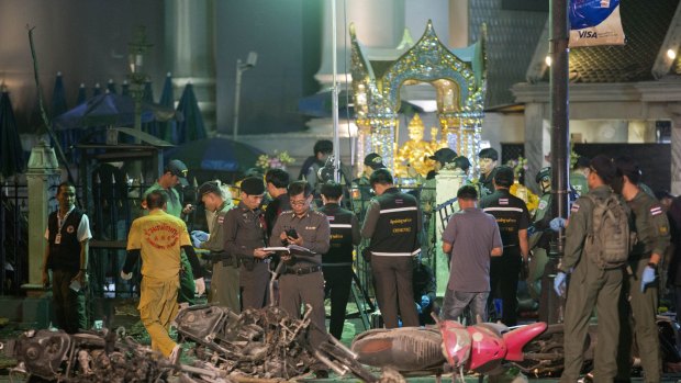 Police investigate the scene at the Erawan Shrine after the explosion in Bangkok in August.