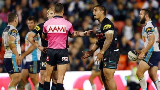 Penrith players Peter Wallace and Sika Manu complain to the referee after a tackle involving Gold Coast co-captain Greg Bird.