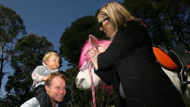 Andrew King and Janice Burns with their son Angus at their new Eltham home that is to become a retreat for families.