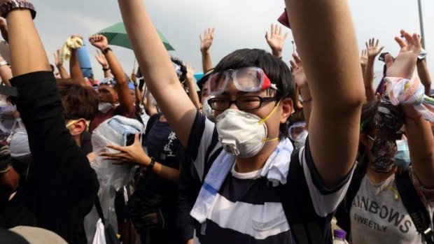 Prepared for the worst: Students don masks to protect themselves against tear gas.