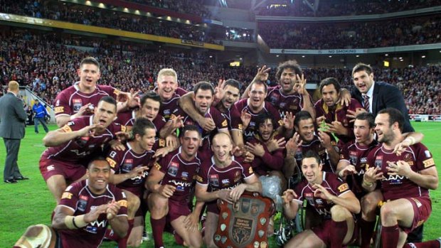 Perfect performance ... the Queensland team pose with the shield.
