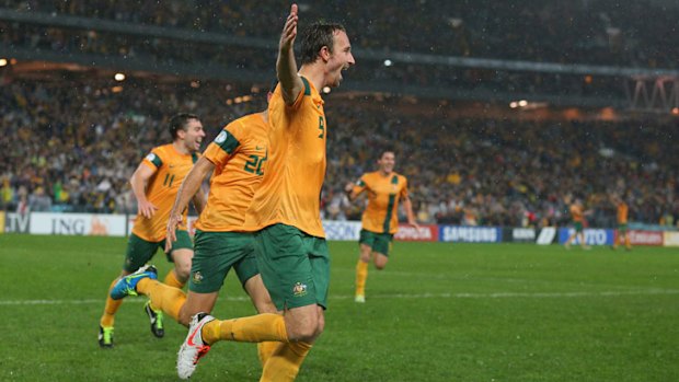 Josh Kennedy celebrates the sweetest of headed goals.