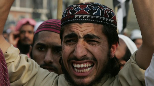 A Pakistani supporter of a man accused of blasphemy a rally in Lahore, Pakistan. 