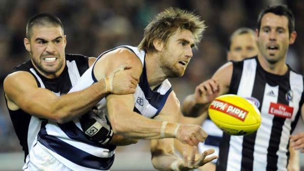 Chris Dawes tackles Tom Lonergan during the round nine Collingwood-Geelong encounter. The Cats won that game by 36 points.