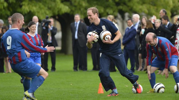 Prince William, Duke of Cambridge, trains with players in the grounds of Buckingham Palace to mark the Football Association's 150th anniversary.
