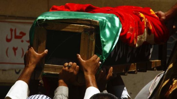 Mourners in Najaf, south of Baghdad, carry the coffin of a victim killed by a car bomb.