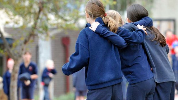 Children at Mount Martha Primary School flout a new rule banning contact between pupils.