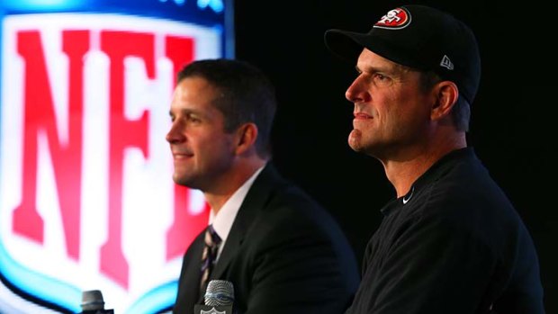 John Harbaugh (L), coach of the Baltimore Ravens and Jim Harbaugh, coach of the San Francisco 49ers.