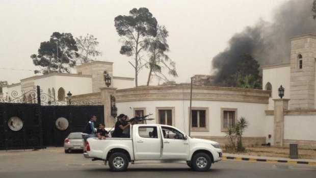 Smoke rises near the parliament building in Libya.