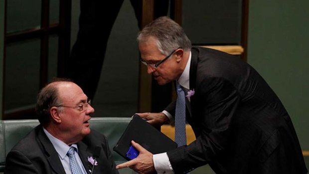 Malcolm Turnbull confronts Coalition Whip Warren Entsch during question time in Parliament.