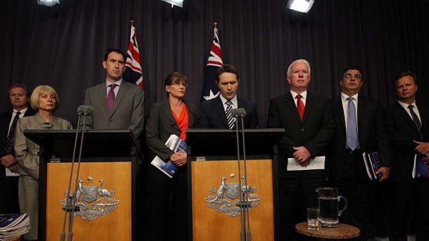 Sports Minister Kate Lundy and Justice Minister Jason Clare, centre, during the joint press conference with sporting code representatives in February.