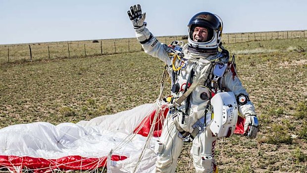 World-renowned ... Felix Baumgartner celebrates after touching down safely.