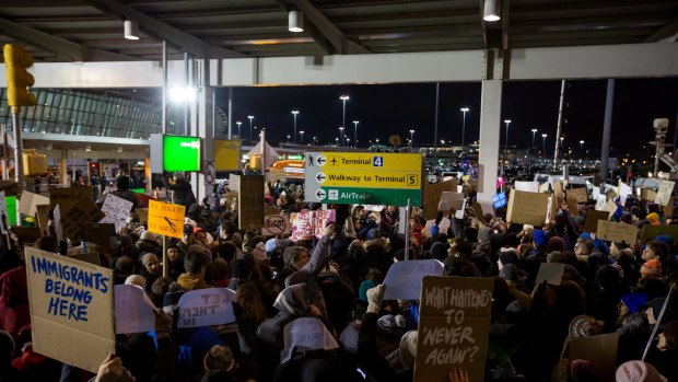 Demonstrators gather outside of John F. Kennedy International Airport (JFK) airport to protest U.S. President Donald Trump's executive order blocking visitors from seven predominantly Muslim nations.