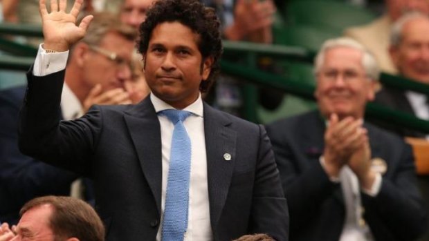 Sachin Tendulkar acknowledges the applause from the crowd at Wimbledon.