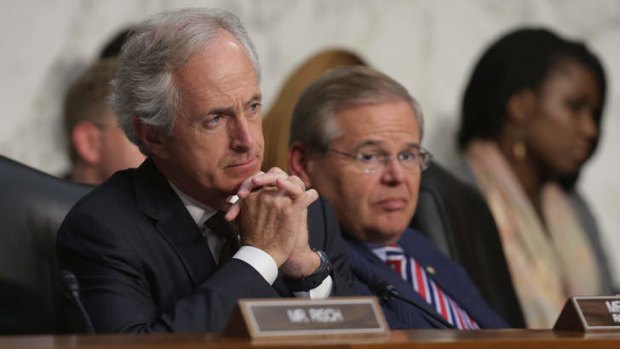 Senate Foreign Relations Committee ranking member Senator Bob Corker (left) and Chairman Robert Menendez (right) listens to witnesses on the topic of 'The Authorisation of Use of Force in Syria' during a committee hearing in Washington, DC.