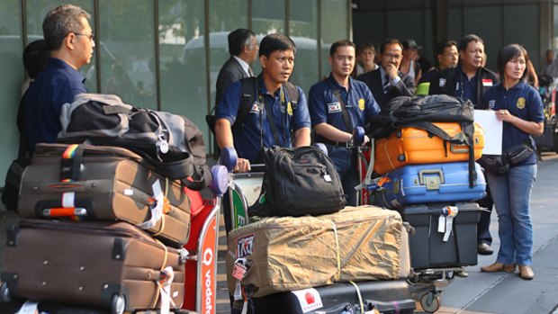 Indonesian body identification experts arrive at Melbourne Airport to assist local police with the large workload from the bushfires.