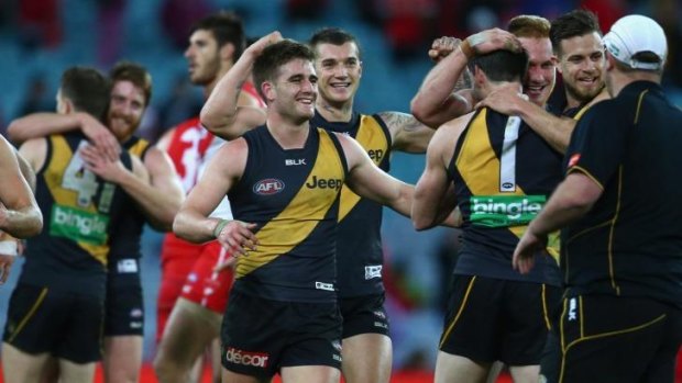 Record breakers: The Tigers celebrate an extraordinary victory over the Sydney Swans at ANZ Stadium on Saturday.
