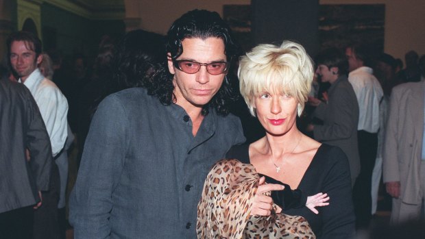 Michael Hutchence, Paula Yates and Heavenly Hiraani Tiger Lily at an art gallery.