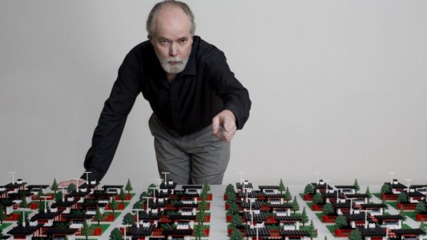 Douglas Coupland with a work from his survey art exhibition in Vancouver, <i>Everywhere is Anywhere is Anything is Everything</i>.
