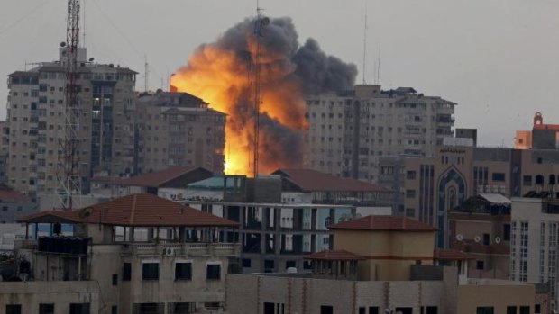 A ball of fire rises from the al-Zafer apartment tower in Gaza City following an Israeli air strike on Saturday.