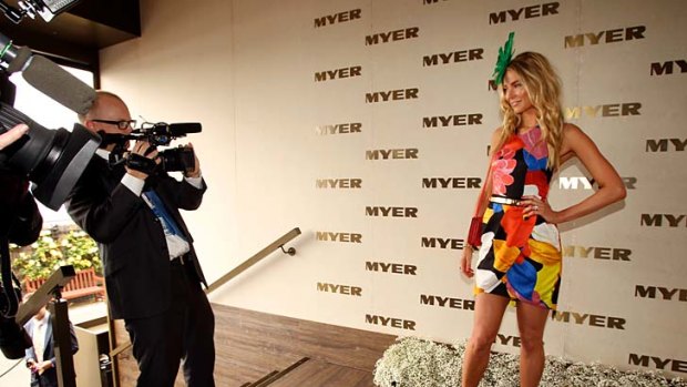 The face of the race that stops the nation: Jennifer Hawkins in the Myer marquee at Flemington last year.