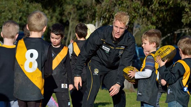 Child's play: Steve Morris conducts a clinic at Yarra Bend Park yesterday.